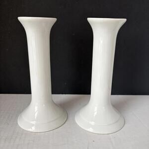 A pair of vintage Ikea white ceramic modern design candlestick holders.